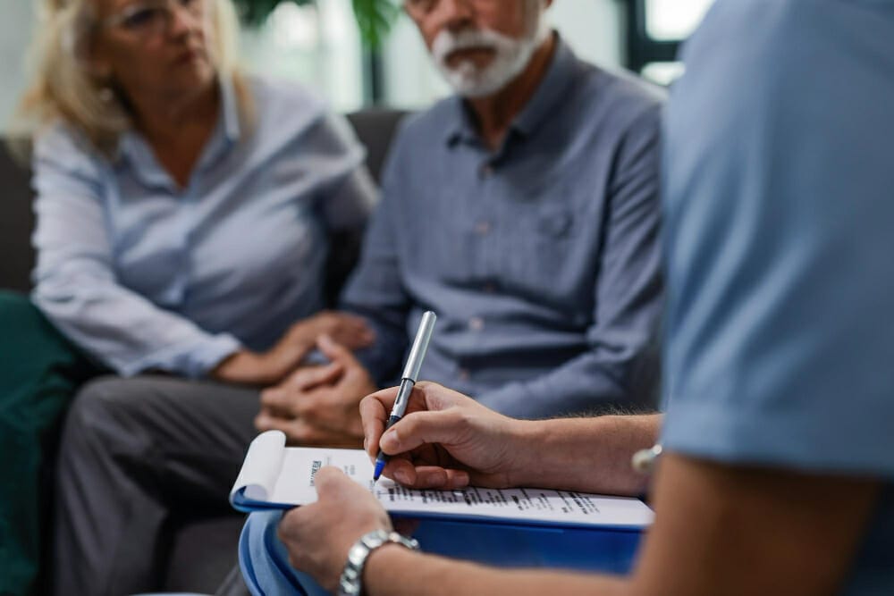 mental health professional taking note treating patient